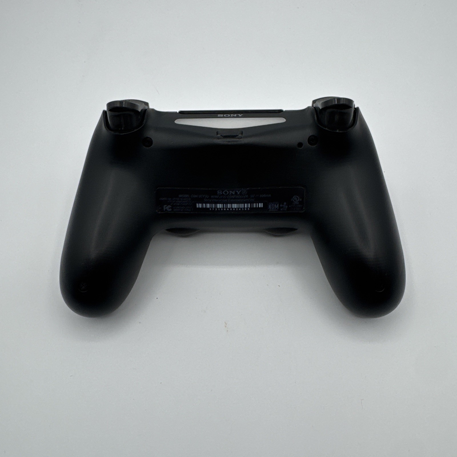 DualShock 4 Wireless Controller - Black - PlayStation 4 — photo 4